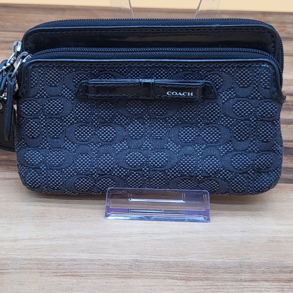 Coach Black Wristlet with Front Bow Detail And 2 Zip Compartments. Like New